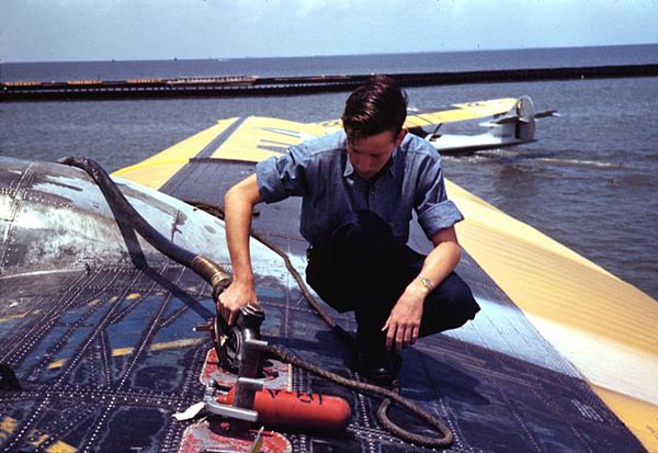 A sailor mechanic refueling a plane at the Naval Air Base Corpus Christi