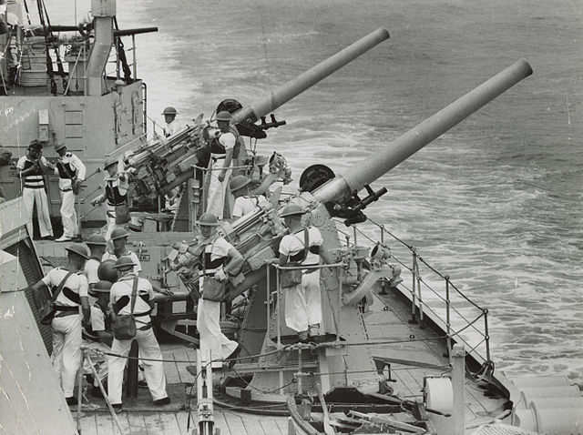 HMAS Sydney's 4-in guns in action