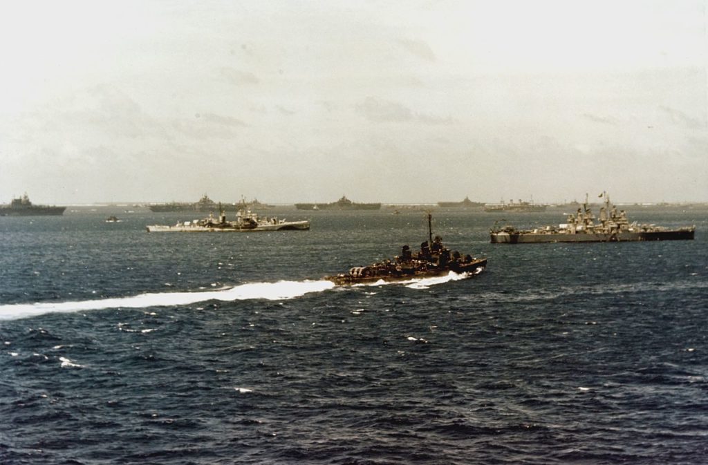 USS Flint and Shannon and carriers of TF 38 resplenishing between operations at Ulythi atoll, March 1945 