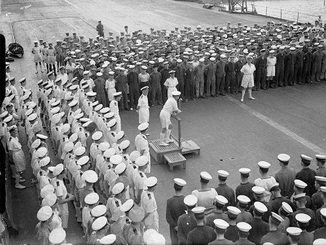 Admiral Sommerville congratulating Ark Royal's crew