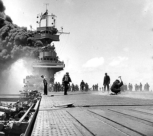 Smoke pours from Yorktown after being hit in the boilers by Japanese dive bombers at Midway